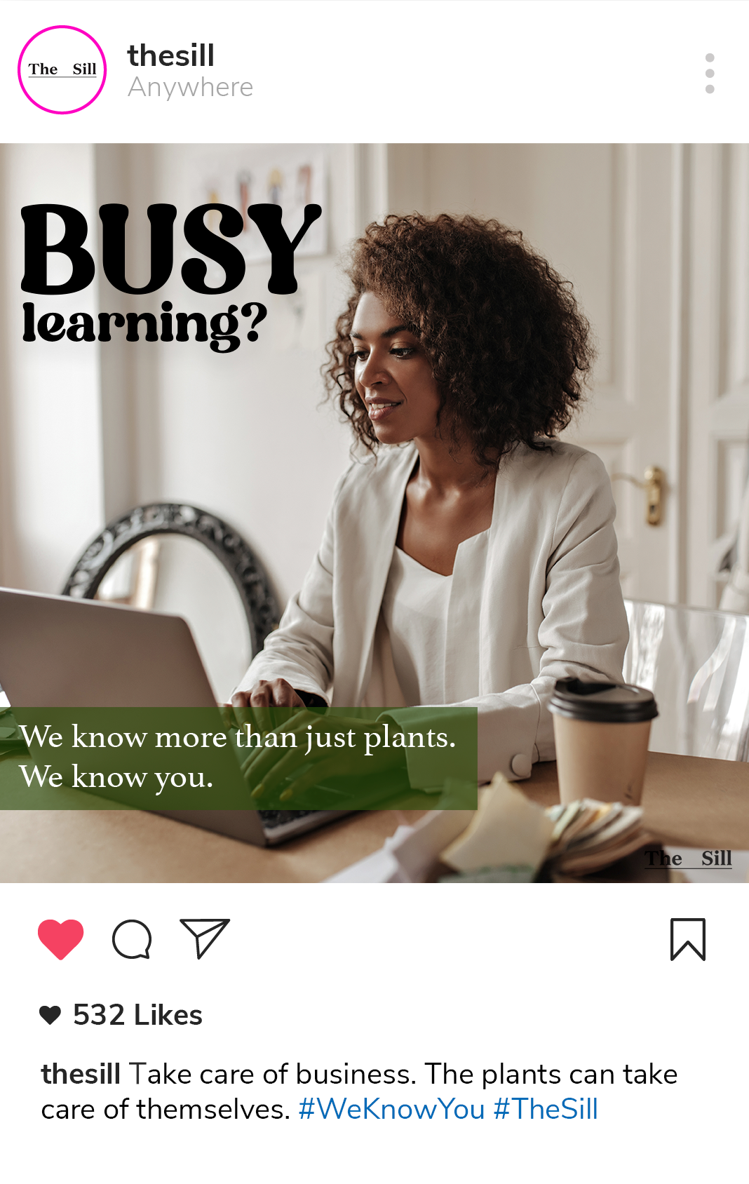 A mockup social post that featues a picture of a woman sitting at a desk at home with text that reads Busy Learning? Text below reads We know more than just plants, we know you. The caption of the social post reads Take care of business. The plants can take care of themselves